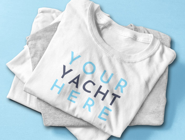 An image of a stack of t-shirts with the words Your Yacht Here on them.