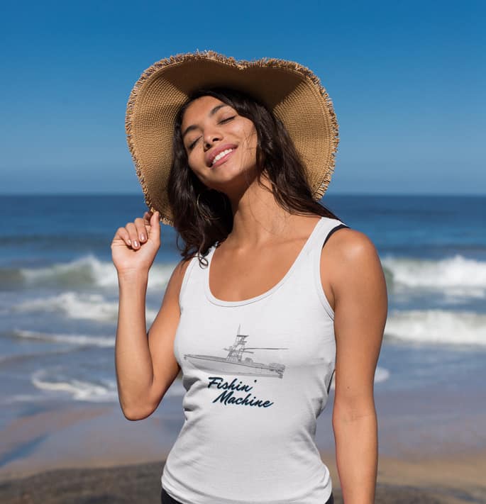 An image of a woman at the beach wearing a custom yacht tank top.