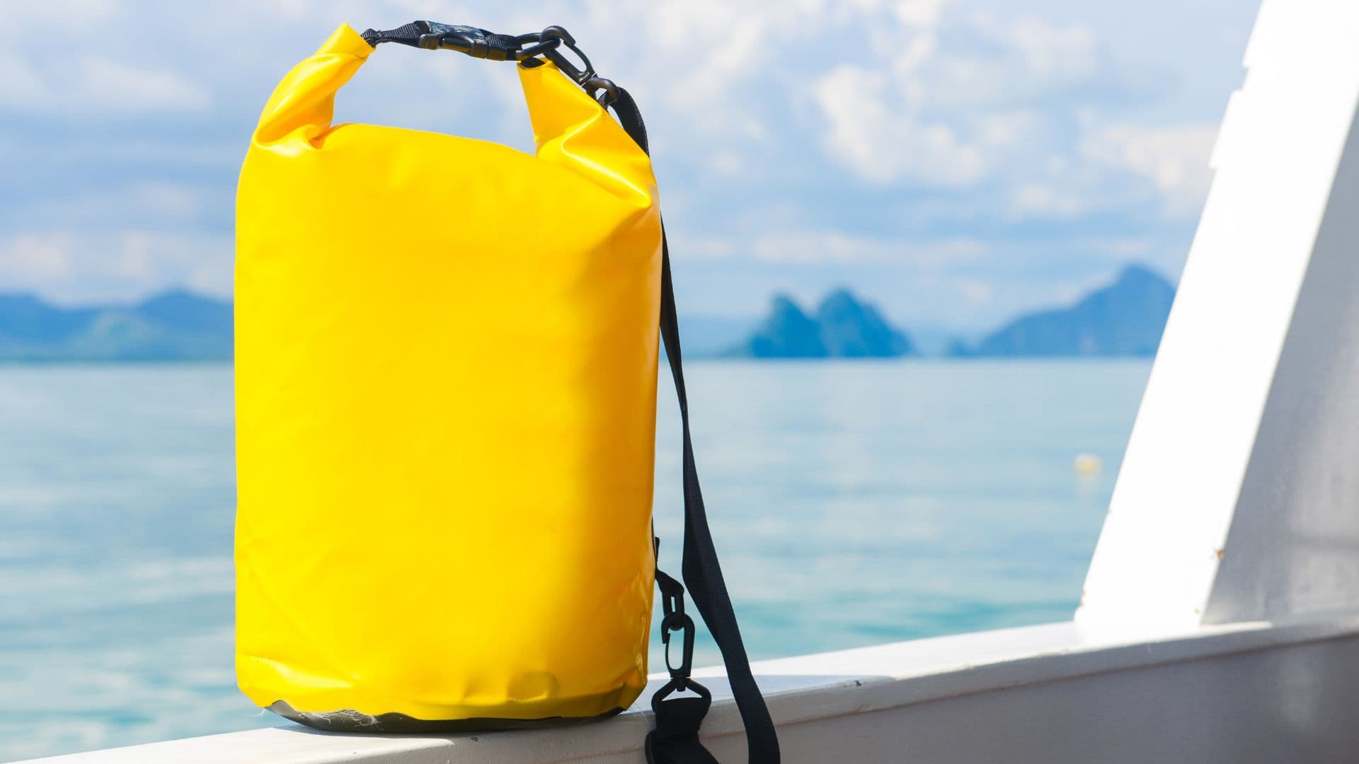 An image of a yellow waterproof bag on a boat. 
