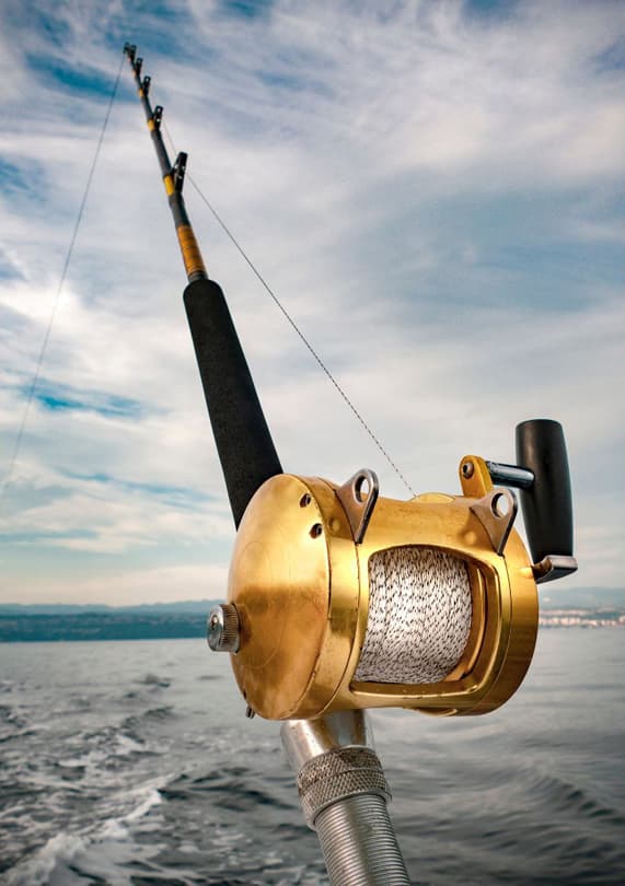 Conventional Trolling reel with line out ready for a day of action on the water. 