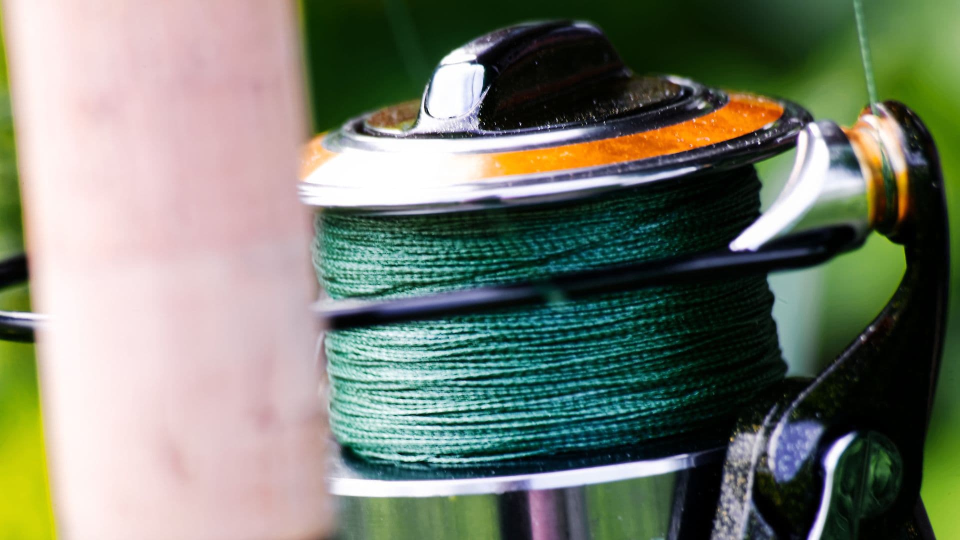 A close up image of braided fishing line spooled on a fishing reel.