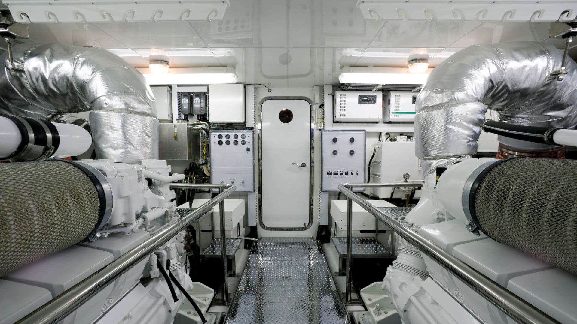 AN image of an engine room on a yacht with inboard engines