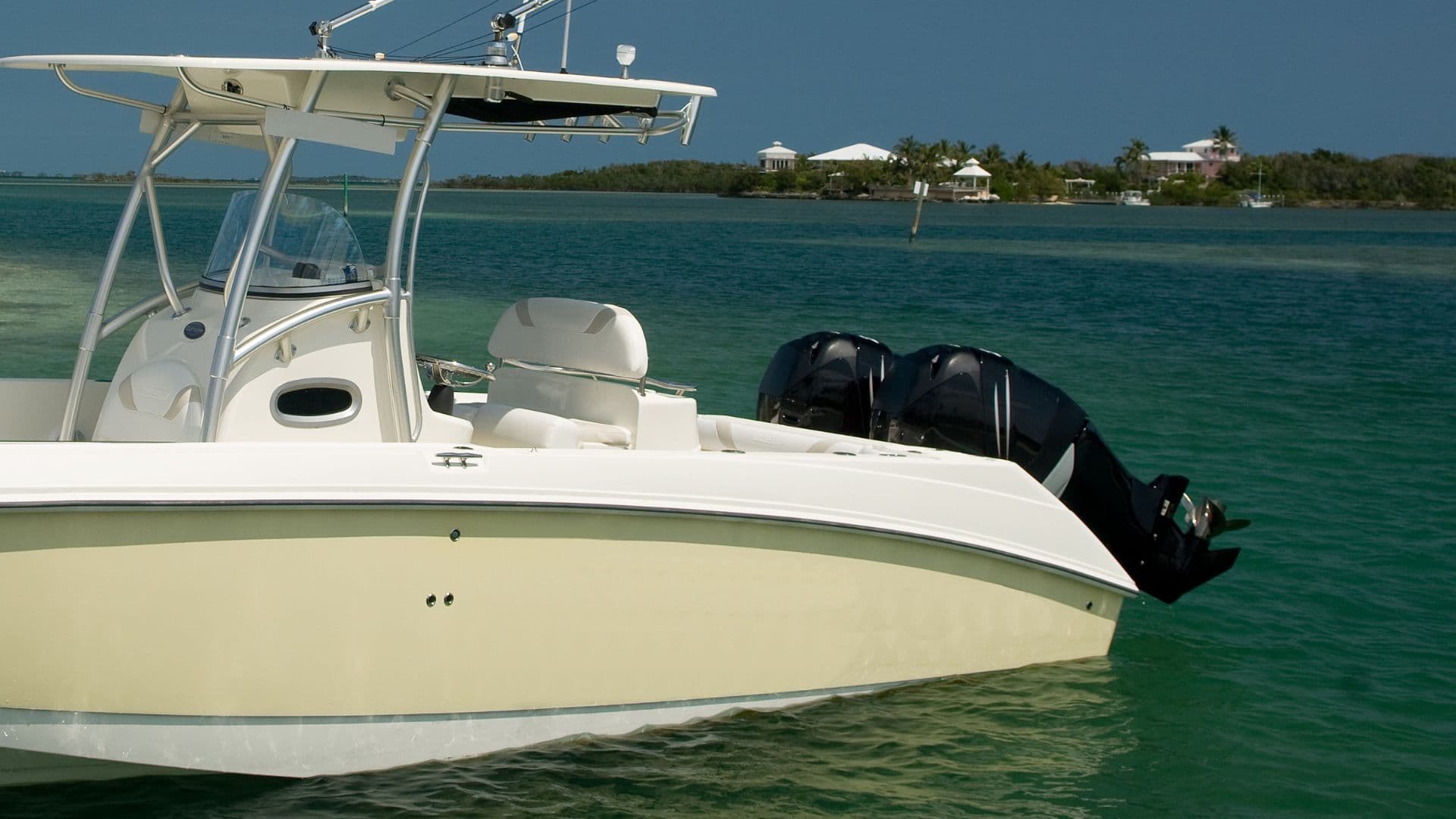 An image of a ccenter console boat with outboard engines on it. 