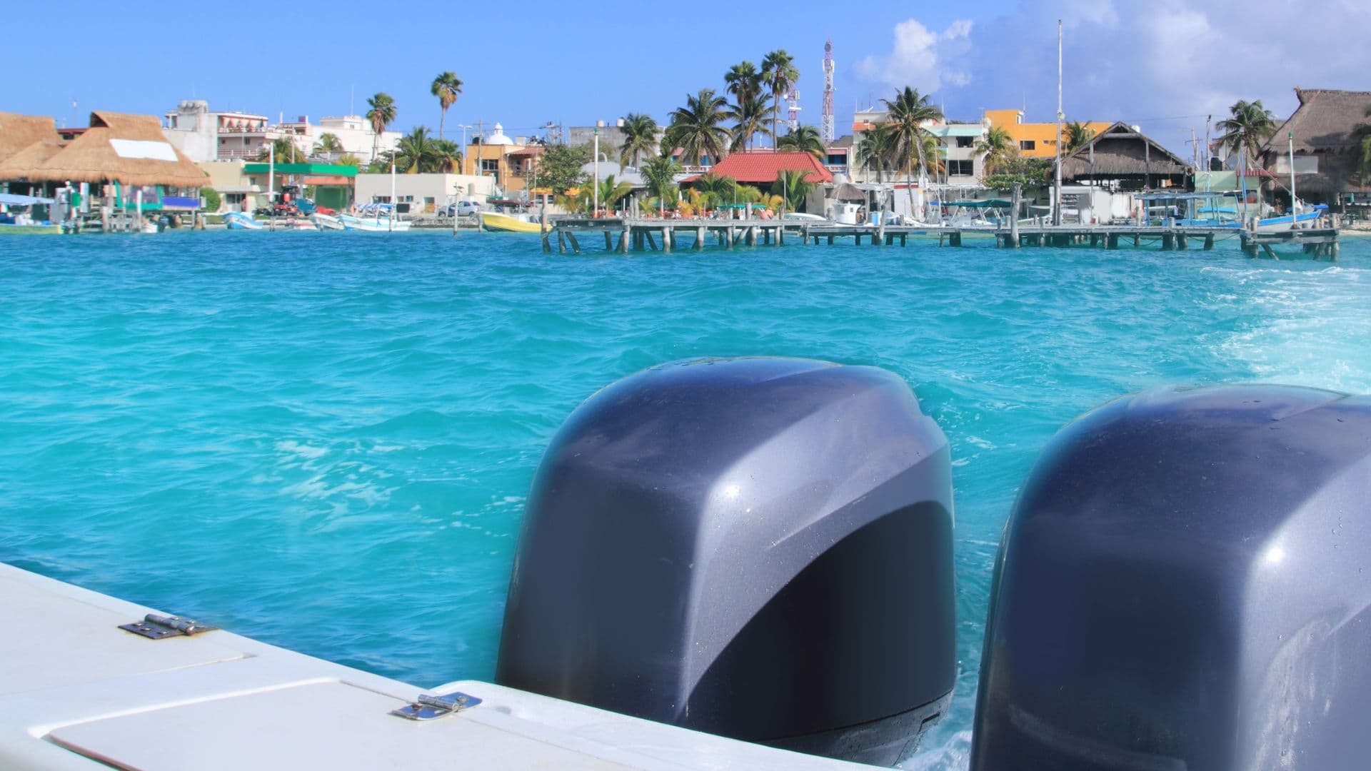 An image of outboard engines on a small boat. 